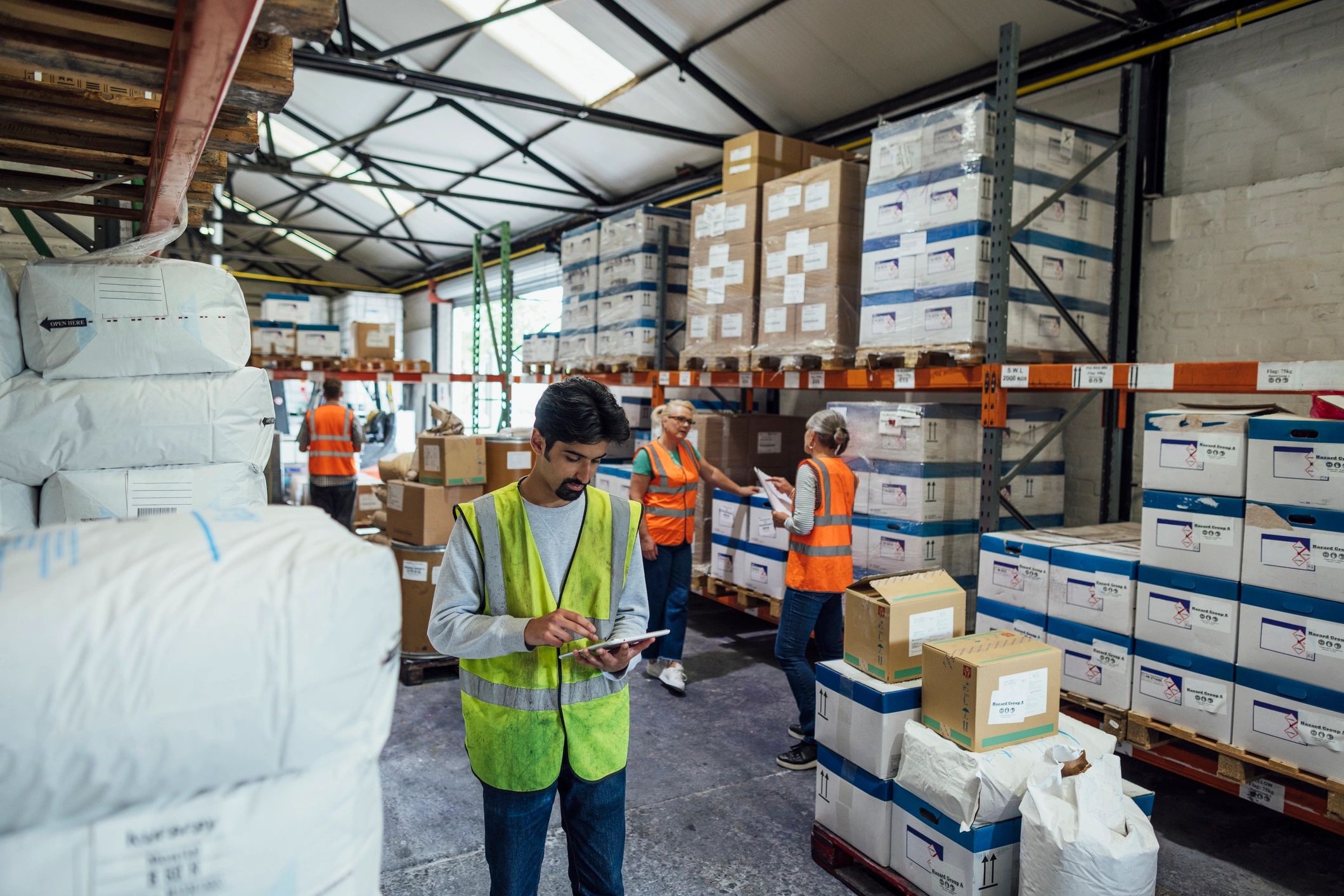 Operations team using digital tools in a warehouse environment