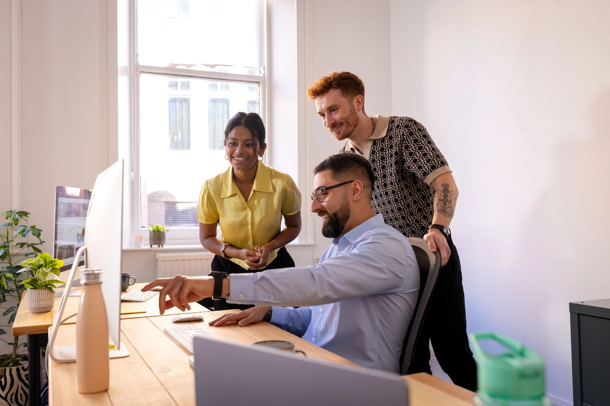 IT professionals collaborating in a modern office