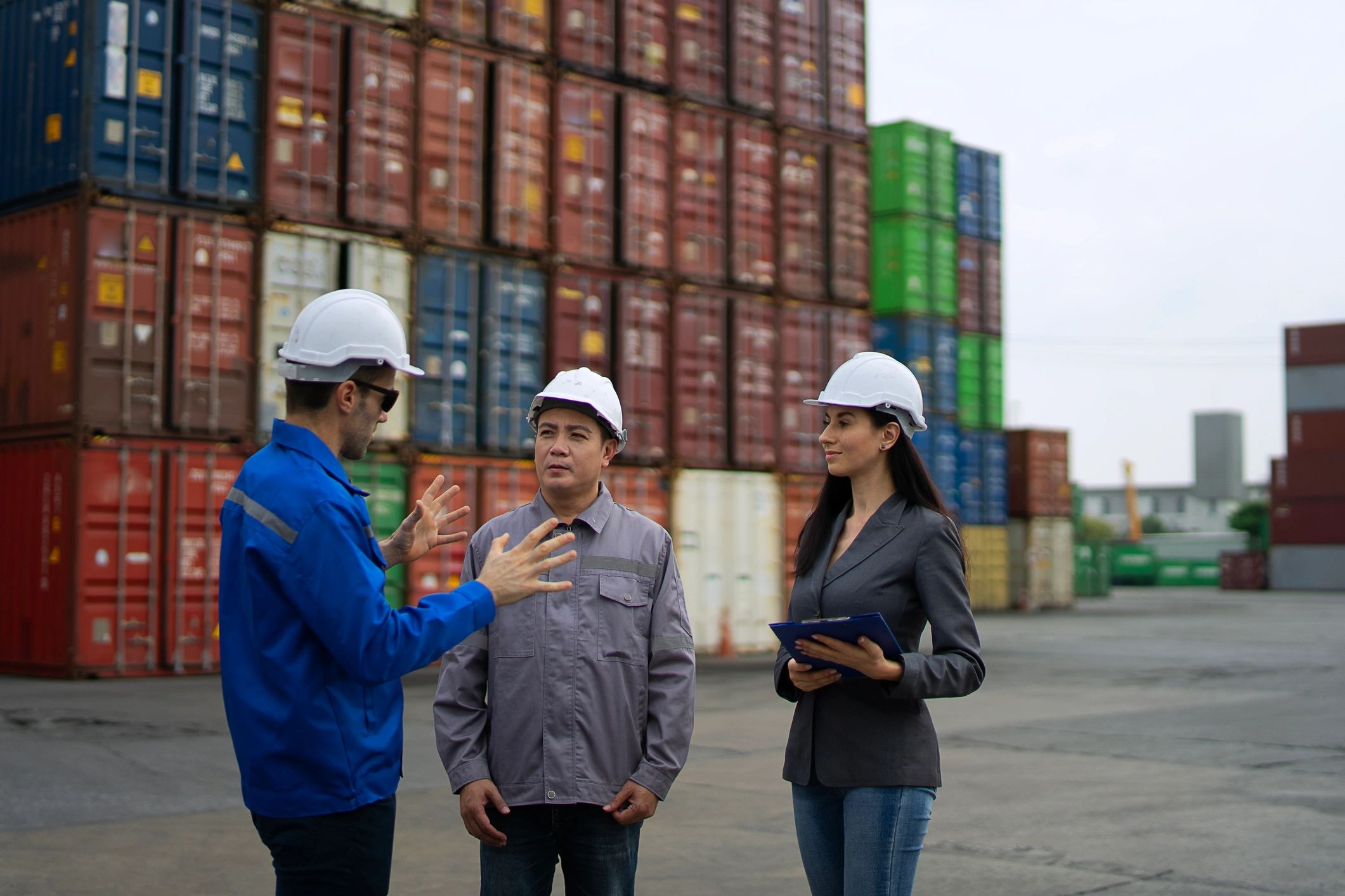 Warehouse workers managing container storage and logistics operations