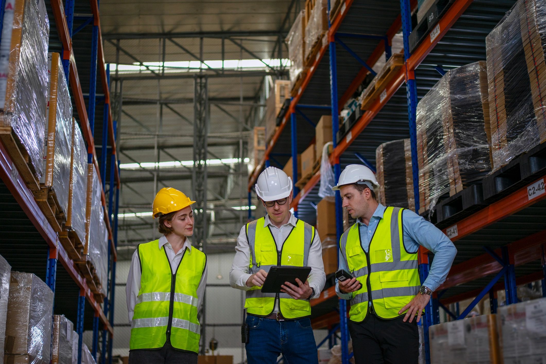 Warehouse staff working together in an industrial facility